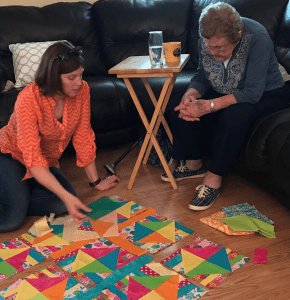 Sharon and Grandma working on quilt
