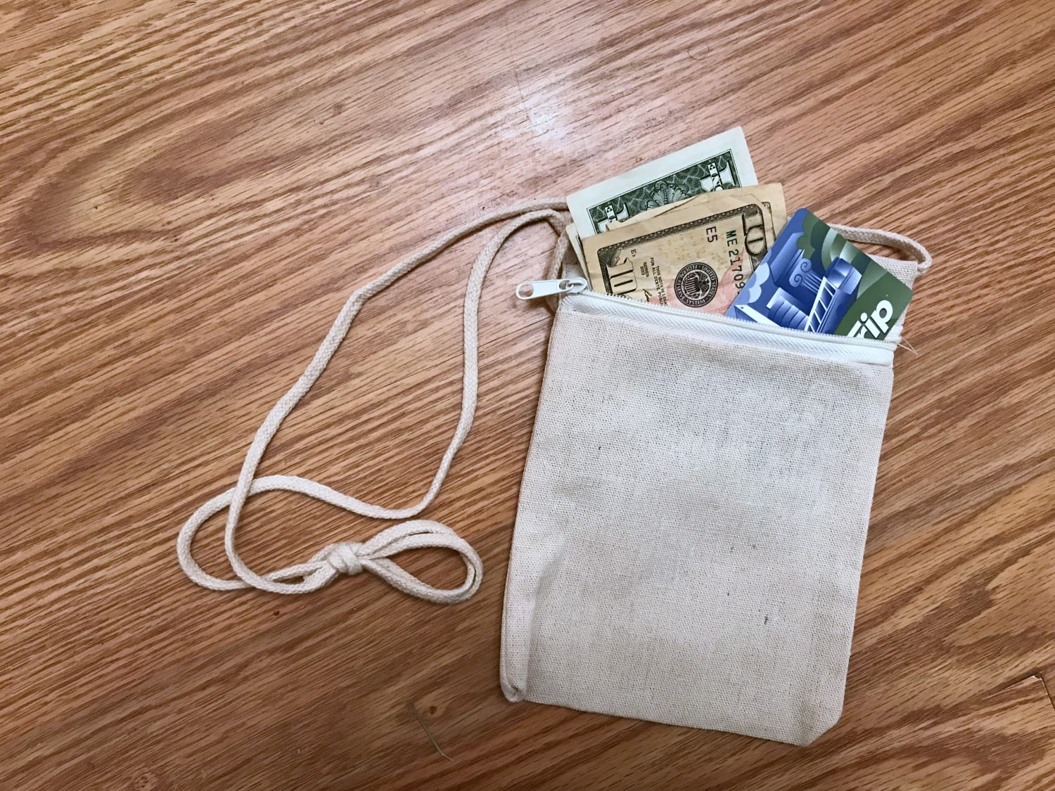 Keep a hidden stash of money in a secure secret purse around your neck.