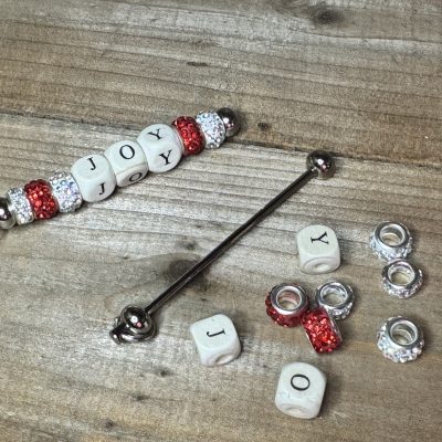 red JOY Keychain bar